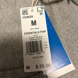 Mens M gray sweats tapered at bottom. Brand new Adidas sweats. Zipper pockets